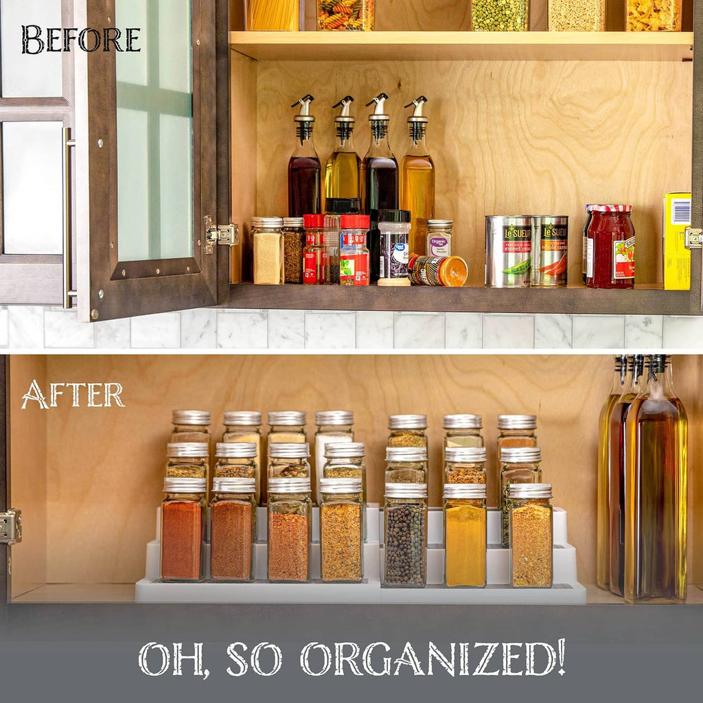 White 3-tier spice rack with gray trays filled with spices and pantry jars.