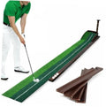 Green indoor golf putting mat with alignment lines and non-slip base, plus practice balls