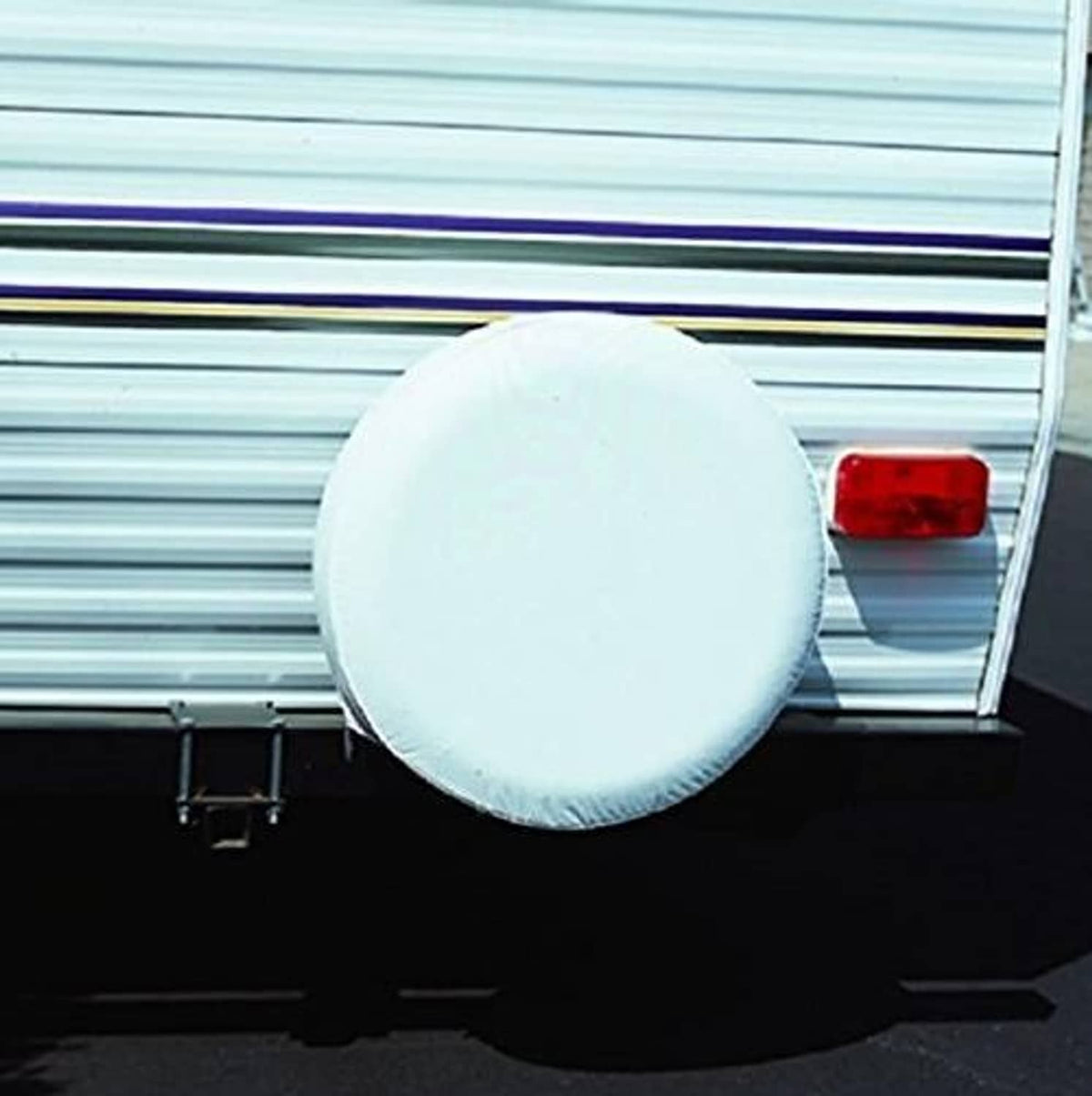 White round spare tire cover, fitted to vehicle exterior