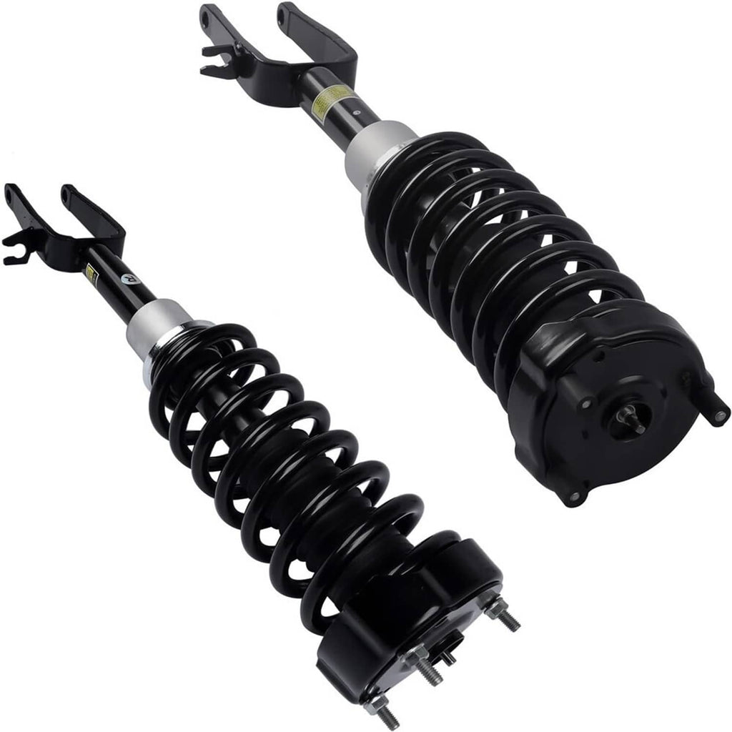 Pair of front shock struts with black coil springs, silver collars, and bracket forks
