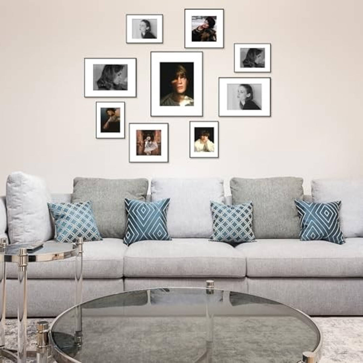 Black aluminum picture frames arranged on wall, with small grayscale photos