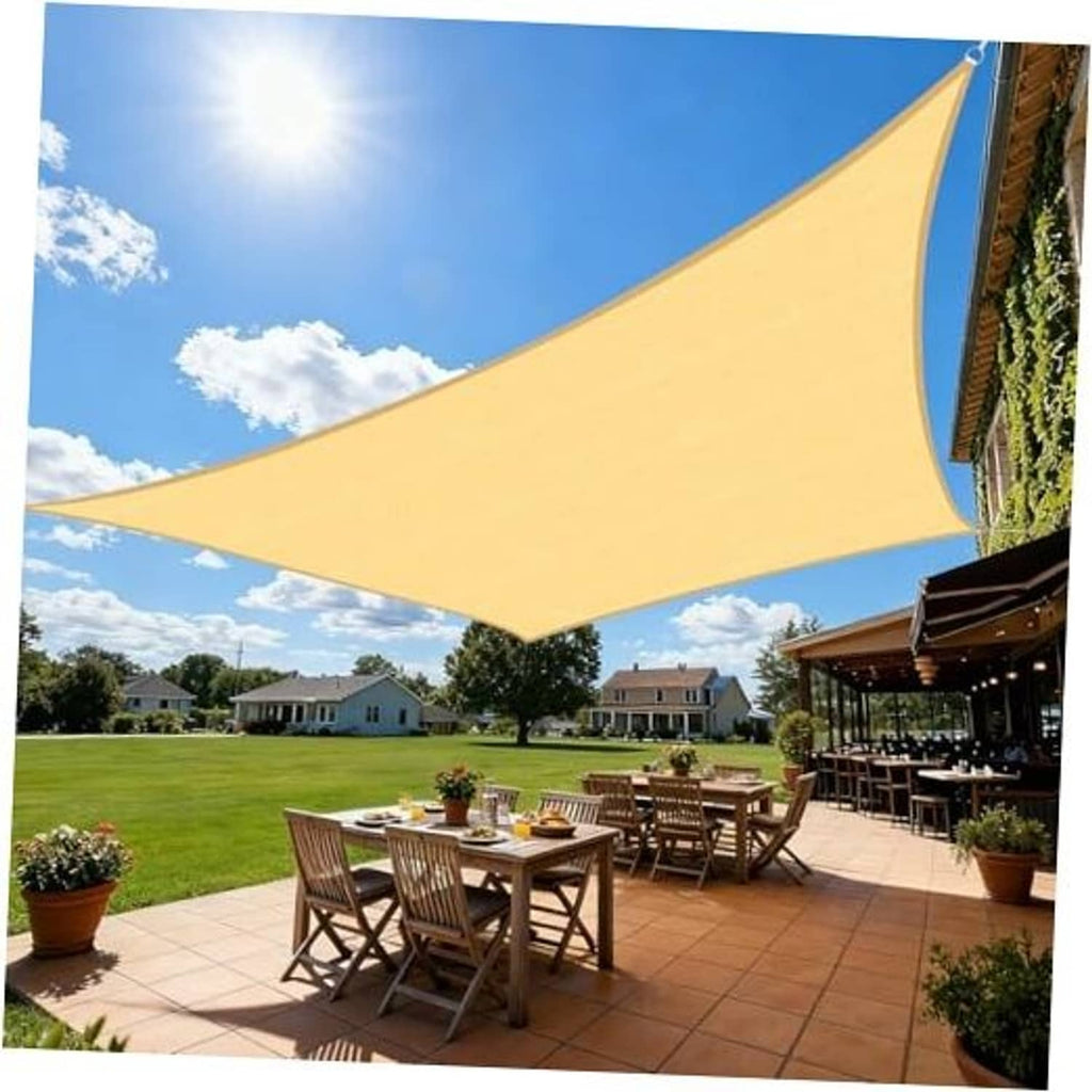 Sand beige rectangle sun shade sail with curved edges, over outdoor patio table set.