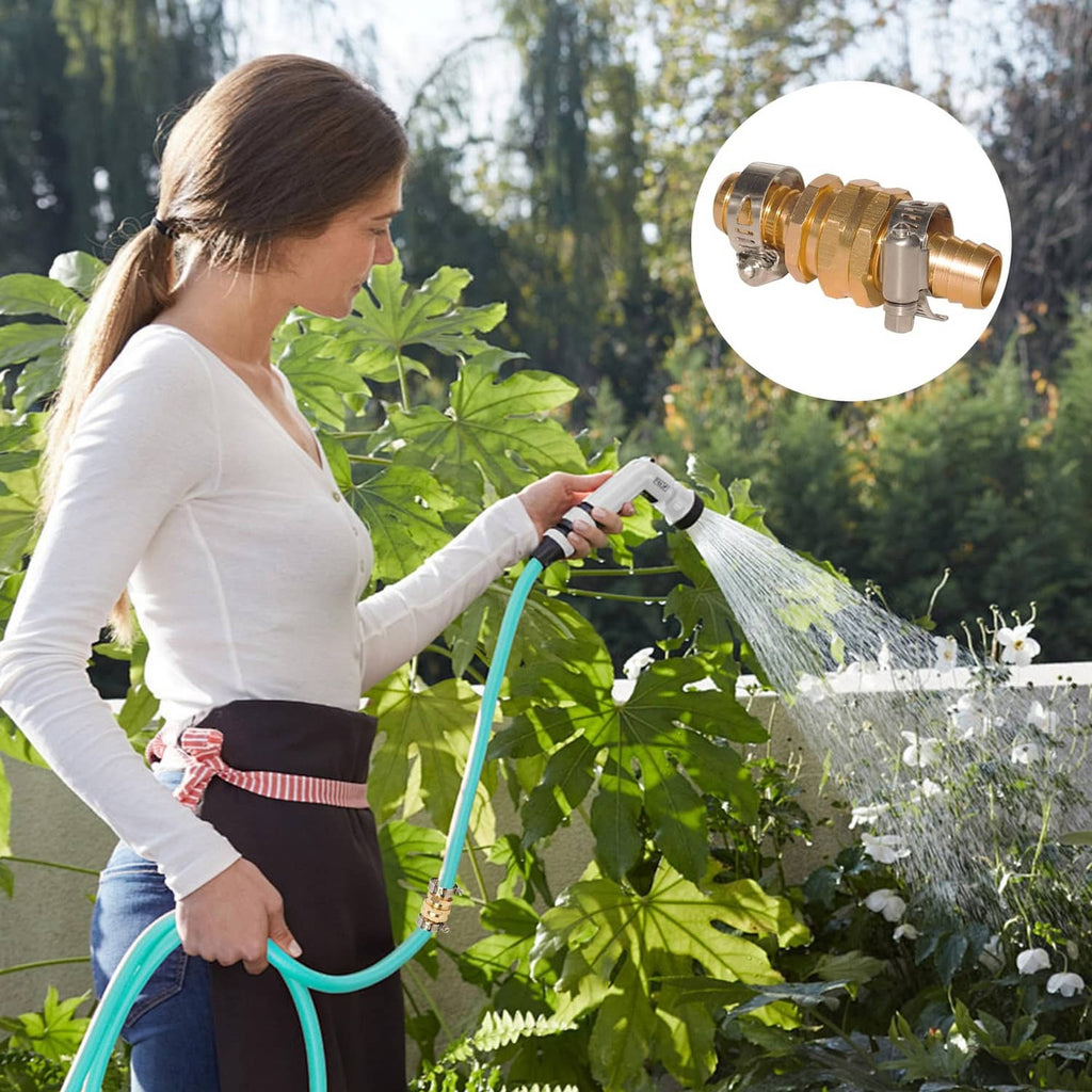 Gold aluminum hose mender connector on a green hose while watering plants, close view