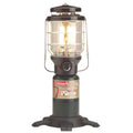 Coleman Northstar gas lantern with clear glass chimney, black base, and glowing burner flame