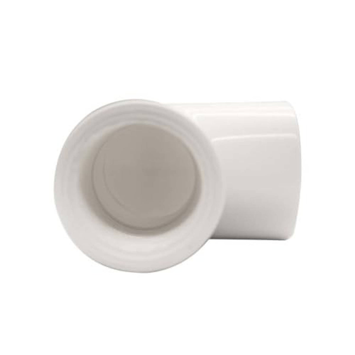 Close-up end view of white PVC 90° elbow fitting with female thread and slip socket