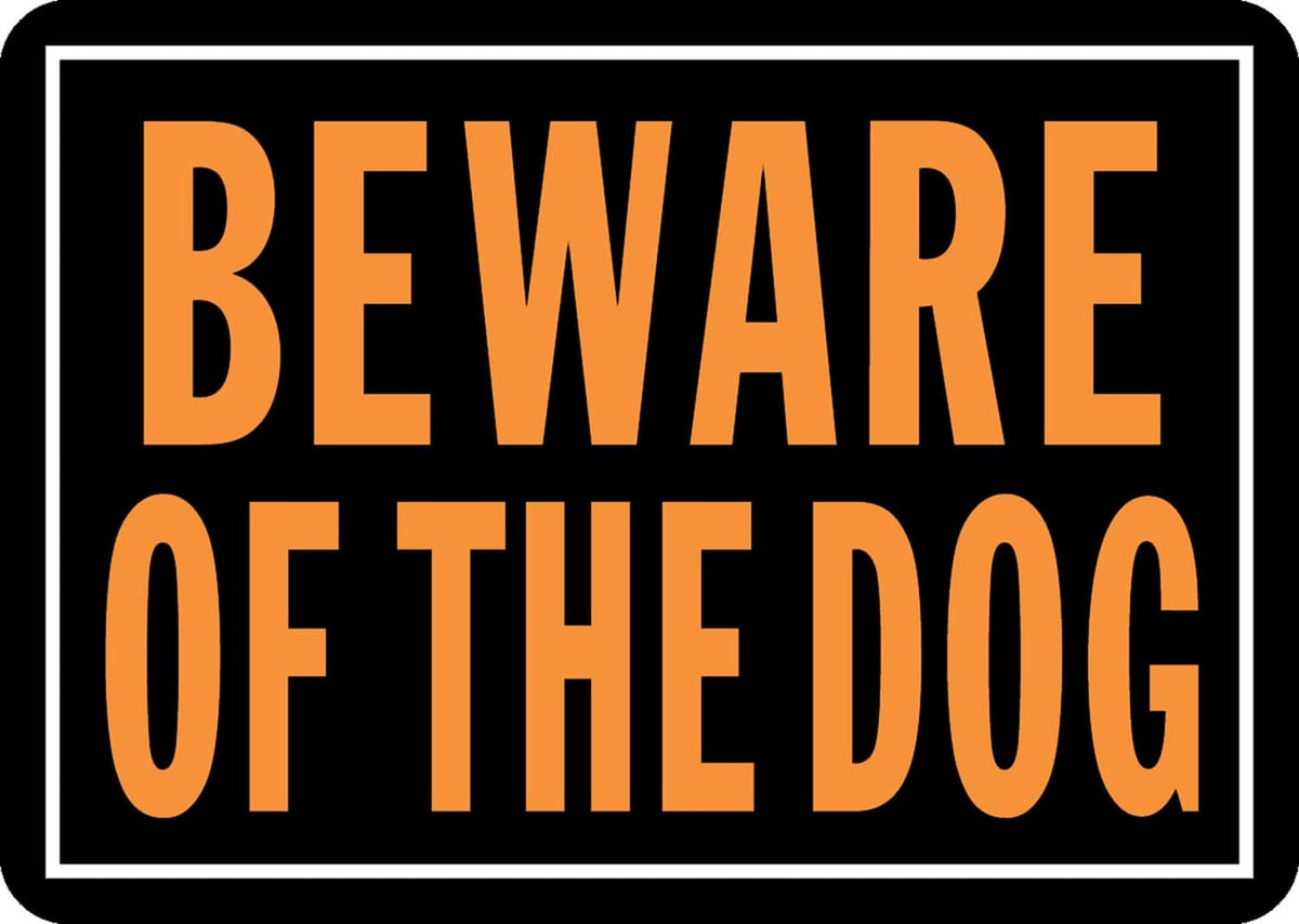 Orange and black aluminum sign reading "BEWARE OF THE DOG".