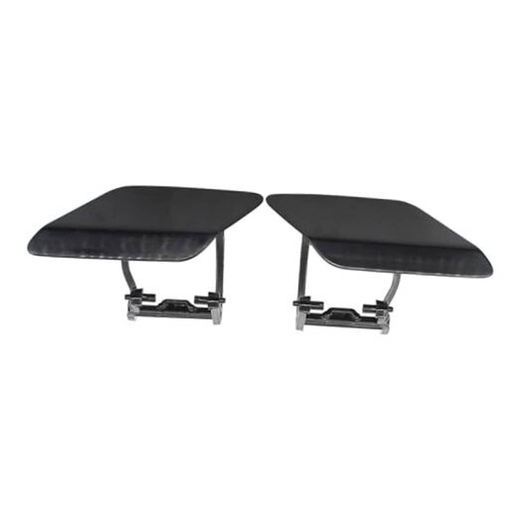 Pair of black headlight washer nozzle caps with mounting brackets, left and right
