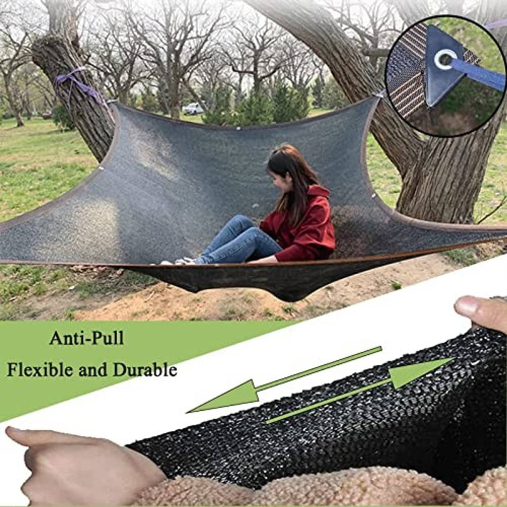 Black shade cloth stretched like a hammock, with brown edge binding and reinforced rings