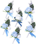 Set of six blue rose and white flower boutonnieres with ribbon and sprigs