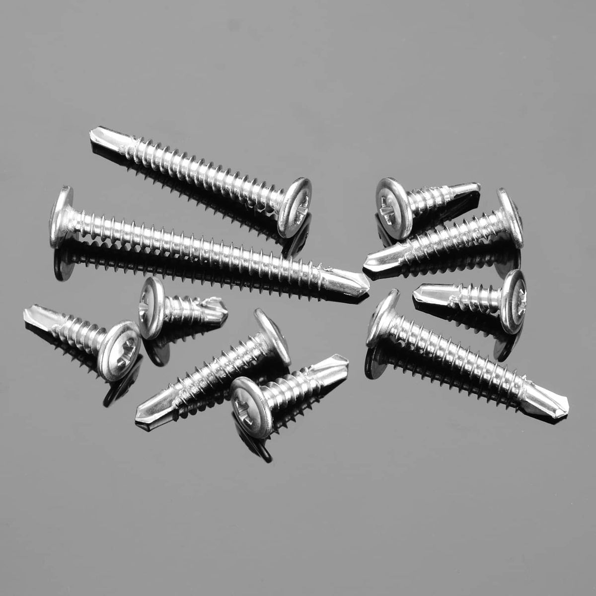 Assorted silver self-tapping screws with truss heads and cross drives