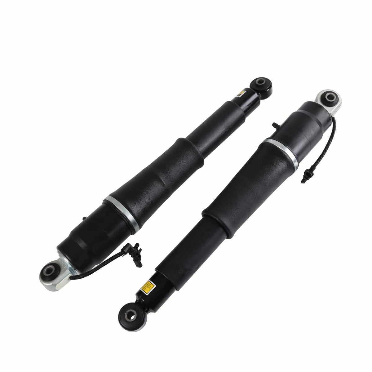 Two black rear air shock absorbers with metal eyelet mounts and wiring on the side