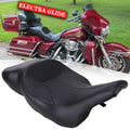 Black motorcycle rider and passenger seat with contoured cushioning and stitched seams