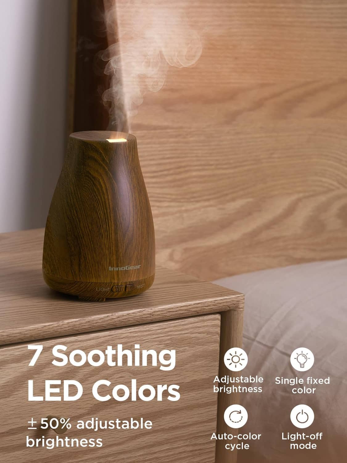 Bronze wood-grain essential oil diffuser with warm LED glow and visible mist