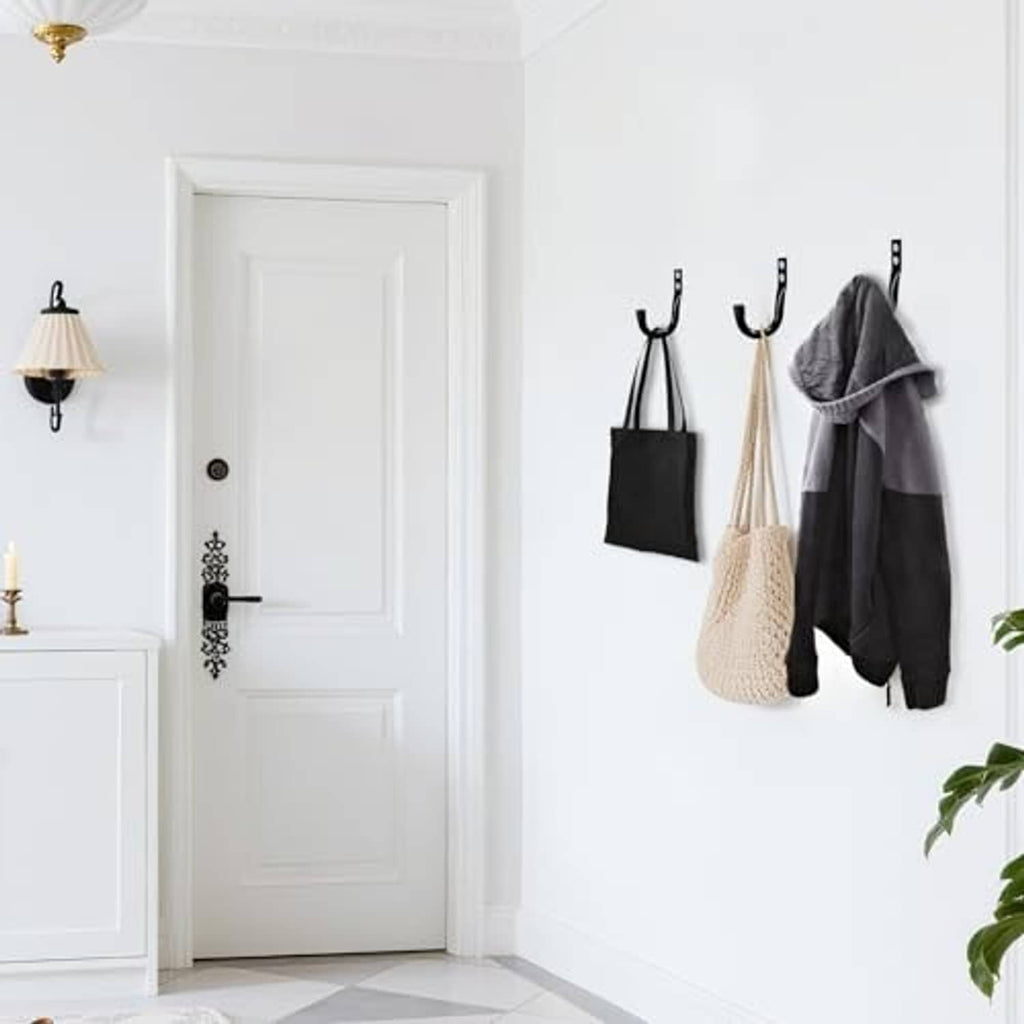 Black wall hooks with two hang points for coats, towels, and tote bags