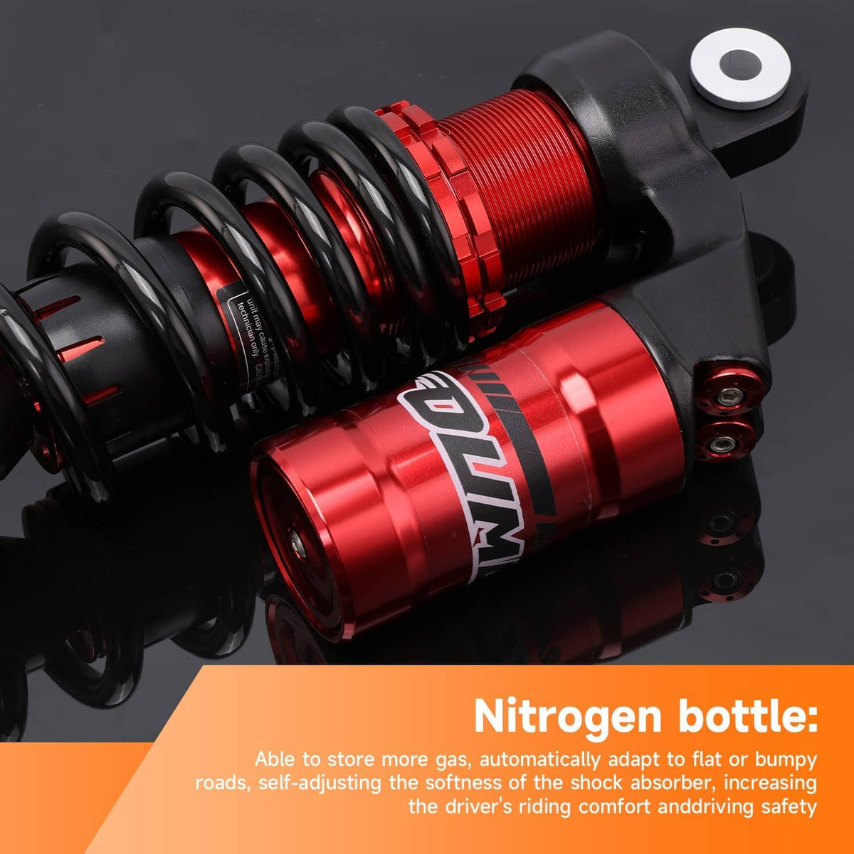 Close-up of red front shock absorber with black coil spring and top mount hardware