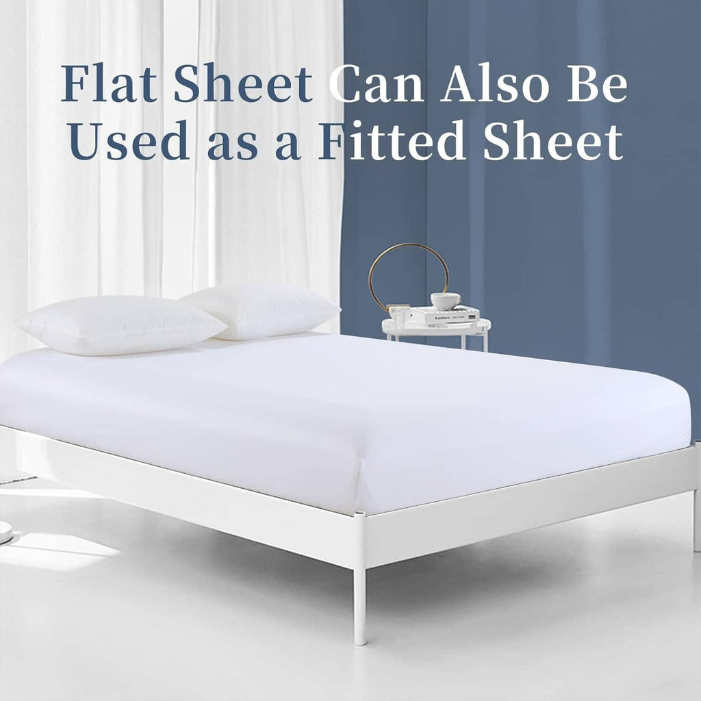 White flat sheet spread over a bed, styled with a tucked edge like a cover