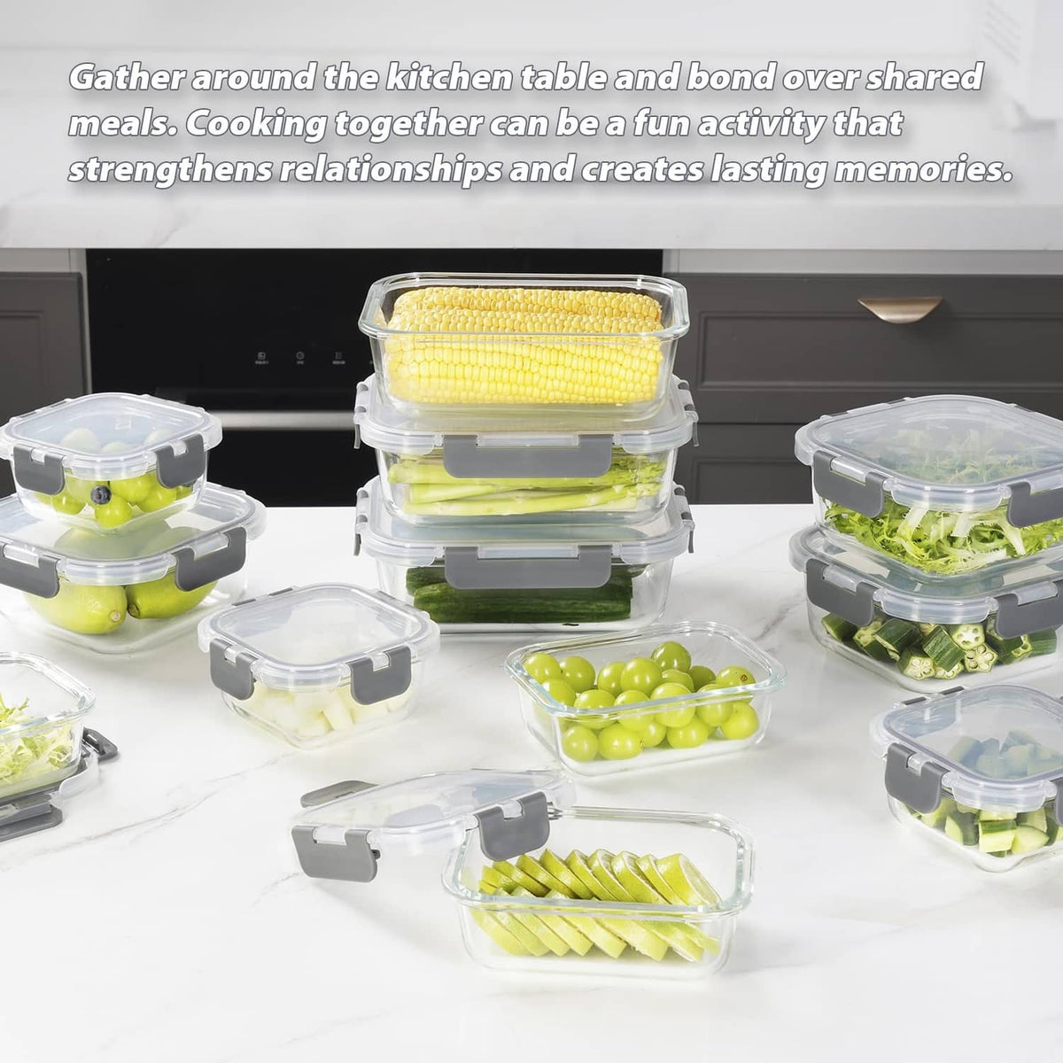 Multiple clear glass food containers with gray snap lids, stacked with vegetables