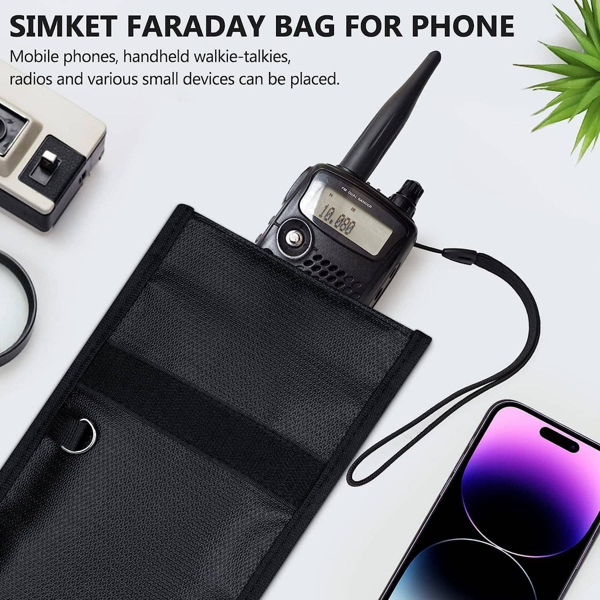 Black Faraday phone bag with front flap, open pocket holding a smartphone