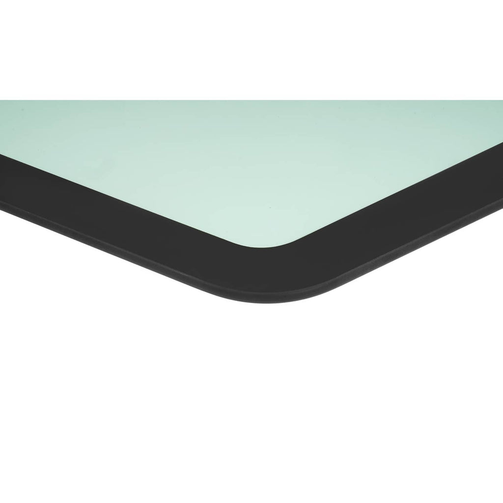 Curved cab glass window edge with black frame and light green tinted glass