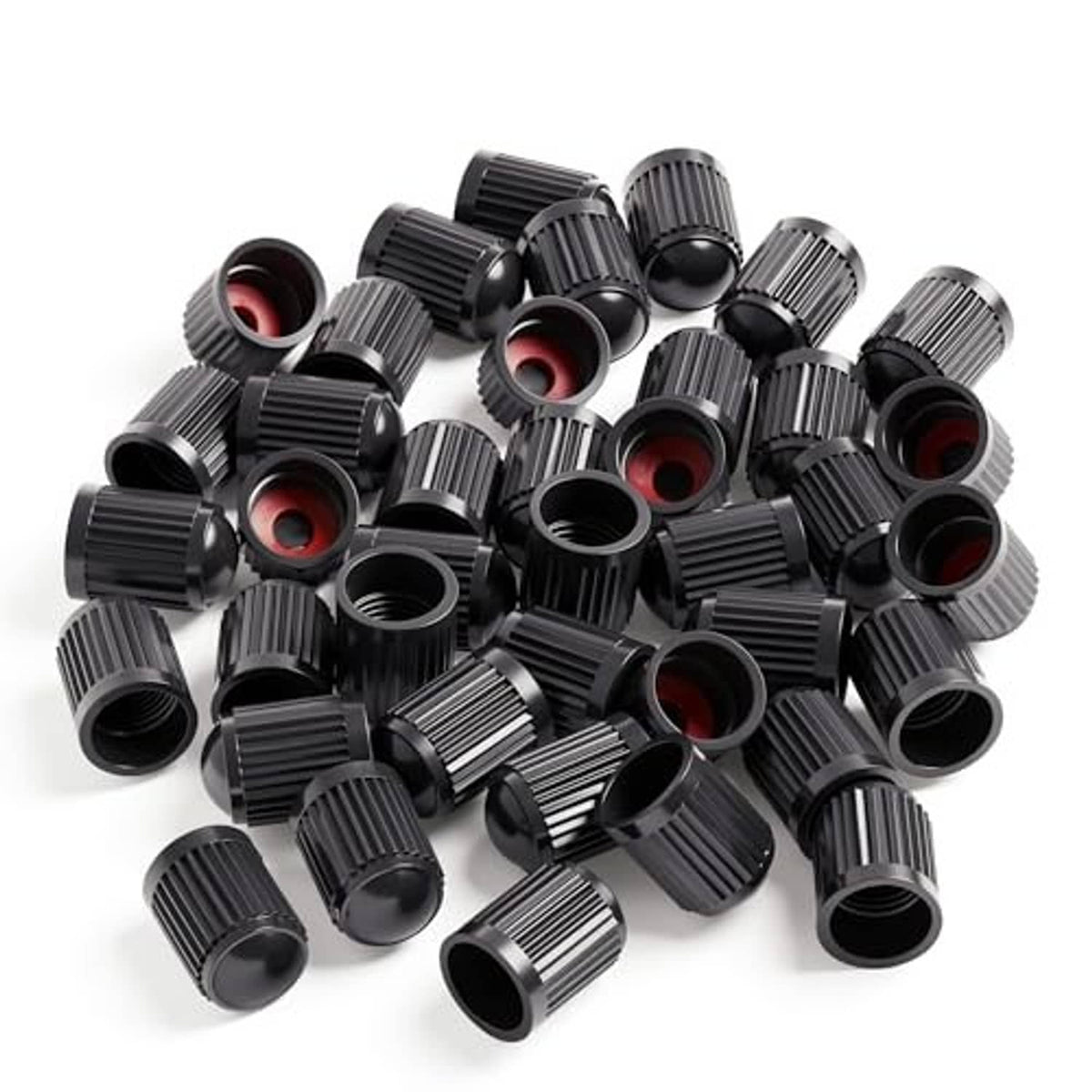 Assorted black ribbed tire valve caps with red O-ring inserts, bulk pack