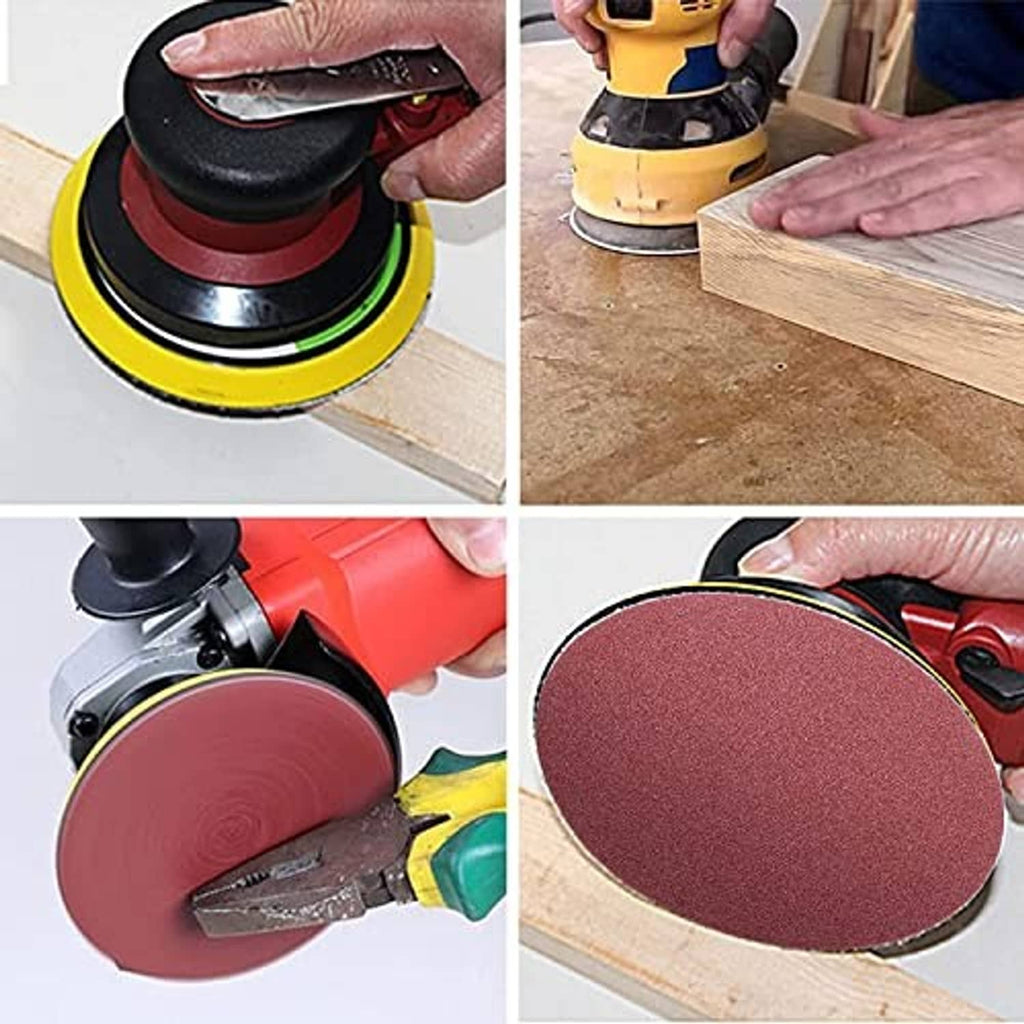 Red sanding disc attached to a sander pad for sanding wood
