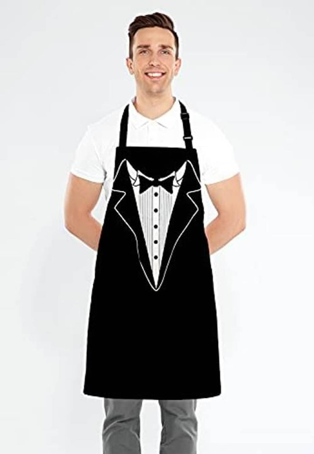 Person wearing a black BBQ apron with tuxedo suit bib graphic over a white shirt.
