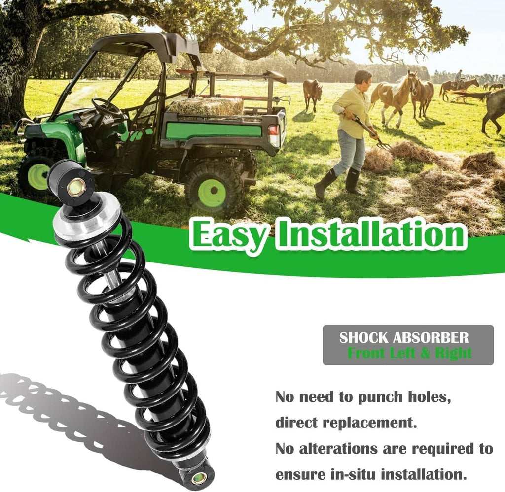 Front left and right suspension shock absorbers with black coils and silver reservoirs