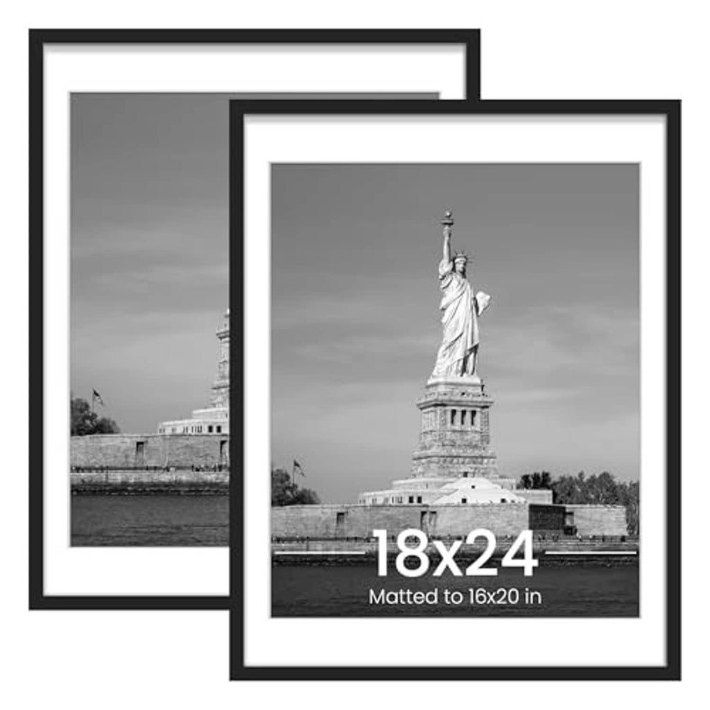 Two black picture frames with white mats, featuring a monochrome poster print