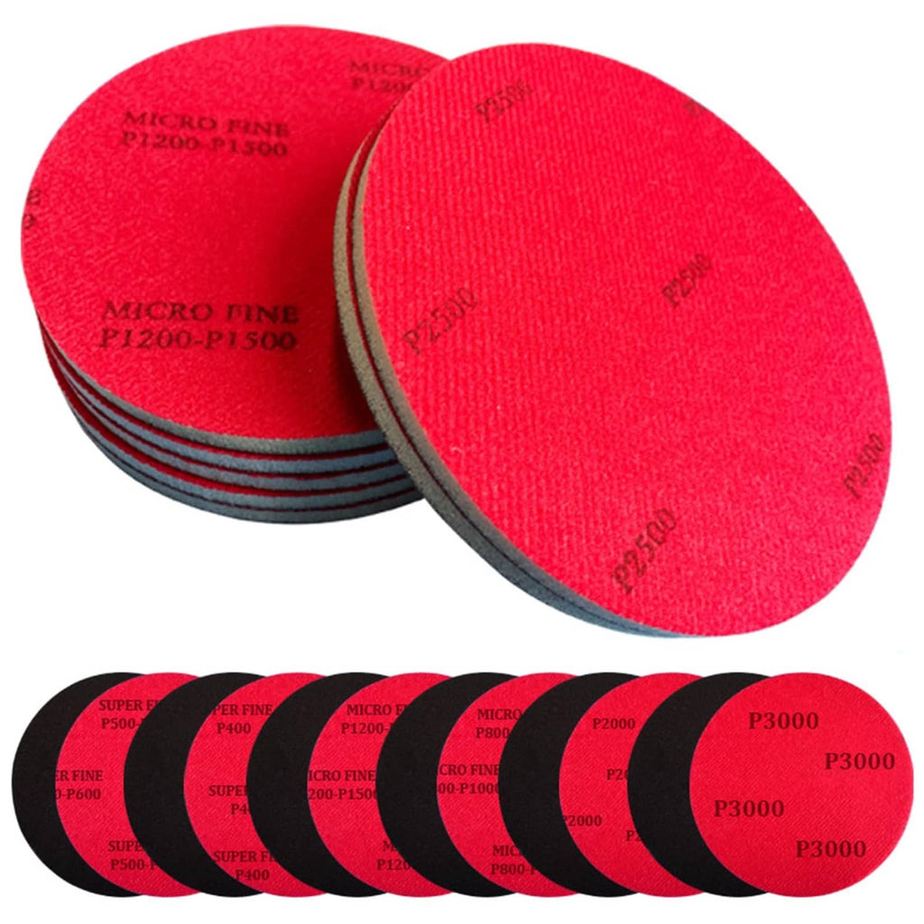 Red circular sanding pads, stacked, 4.7-inch diameter, 0.19-inch thick