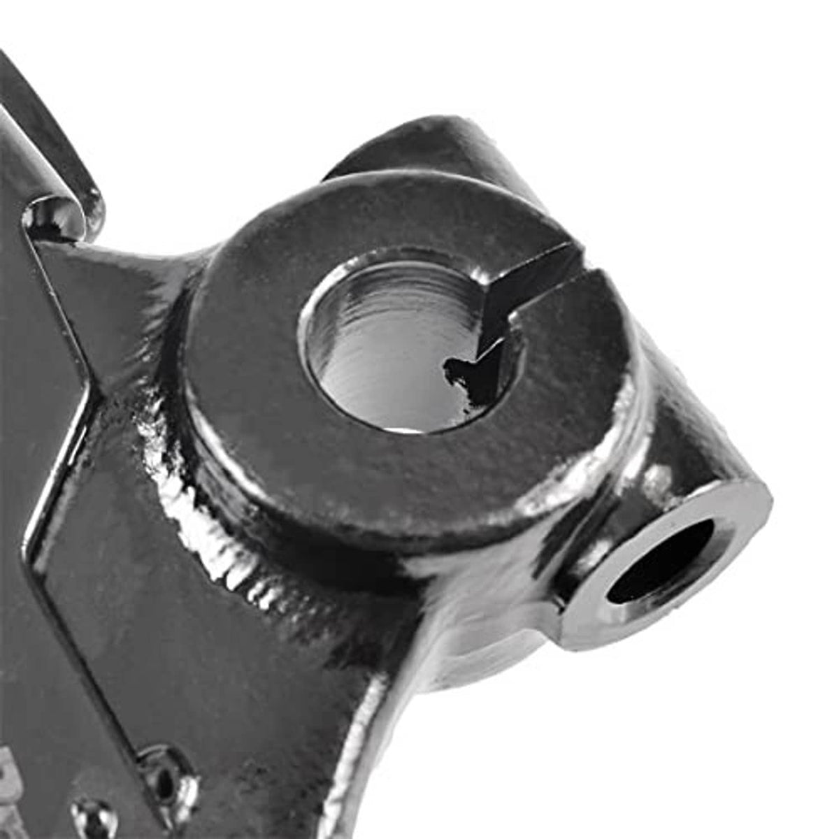 Close-up of ball joint housing and steel control arm armature, black and silver finish