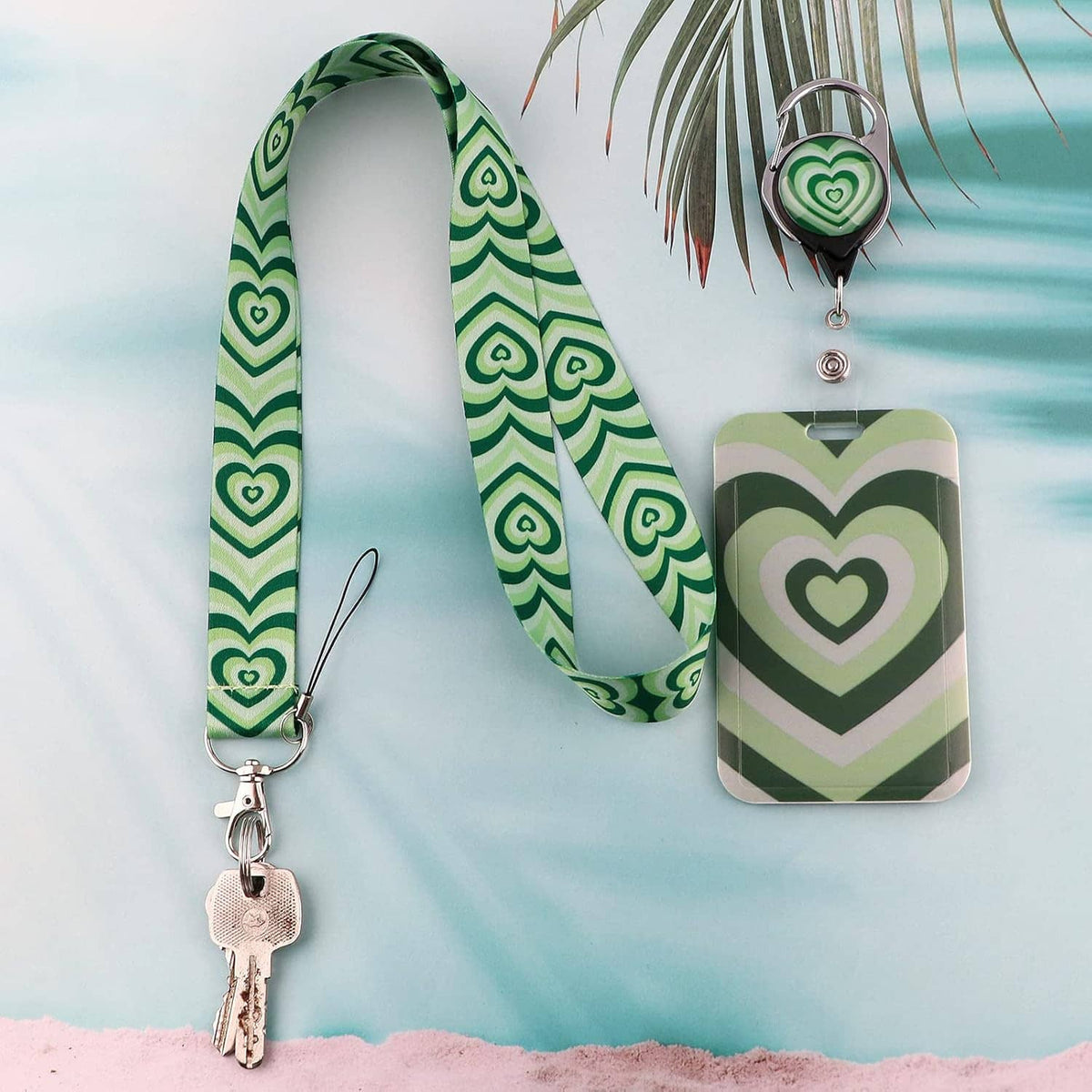 Green heart-pattern lanyard with retractable badge reel and rectangular clear ID sleeve