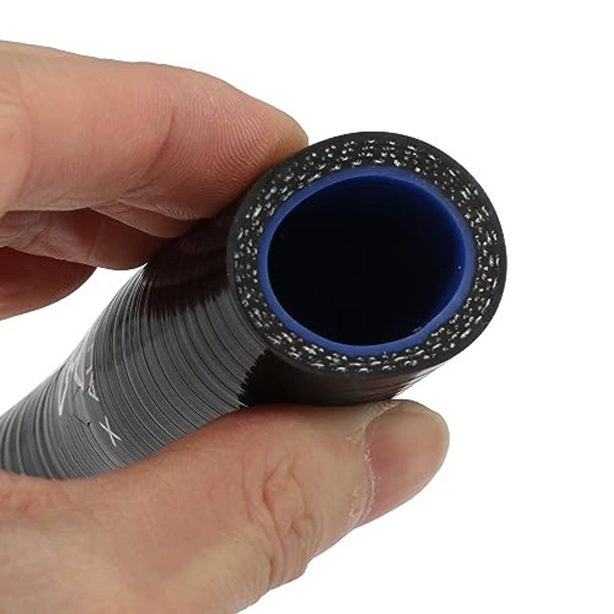 Black hose reducer end with blue inner opening, held between fingers