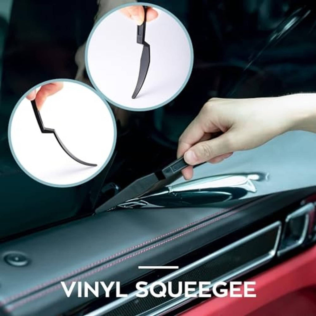 Vinyl squeegee tool trimming window tint film on a car door surface