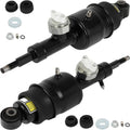Pair of black rear hydraulic air shock struts with mounting hardware and caps