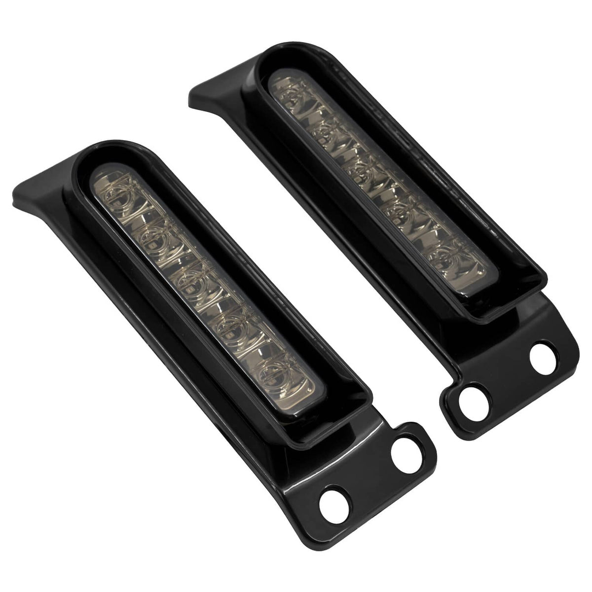 Angled view of black LED saddlebag filler lights with clear rectangular lenses (pair).