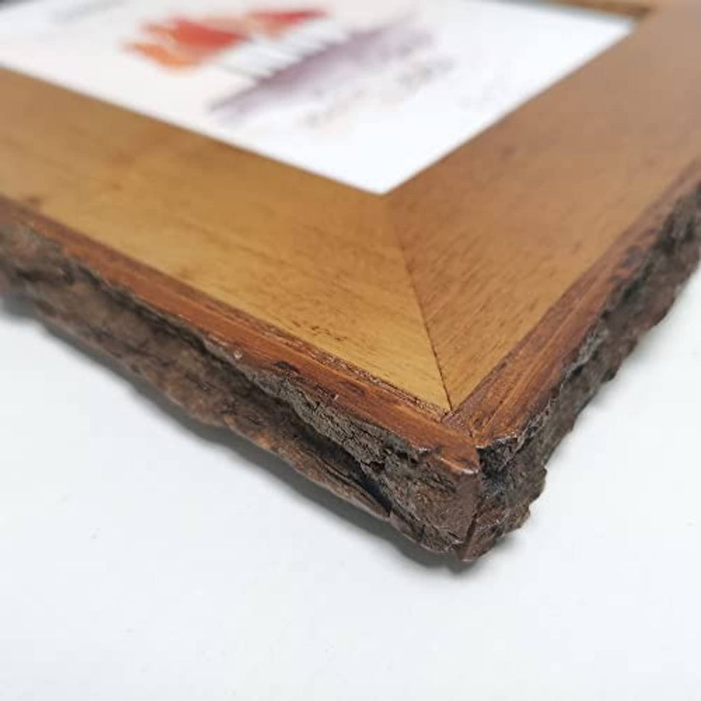 Rustic live-edge wood picture frame corner detail with layered dark bark edges