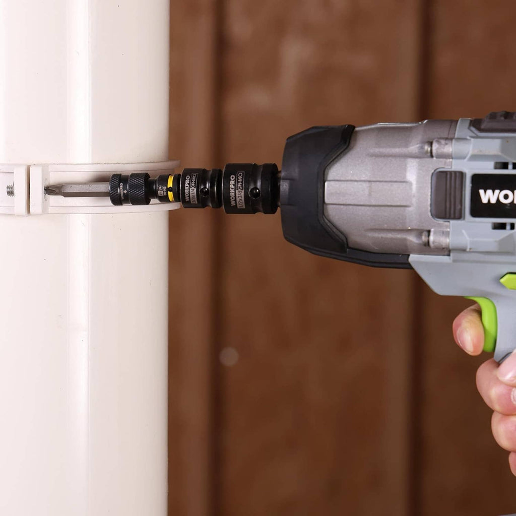 Impact wrench with black socket adapter driving a fastener, yellow ring visible.