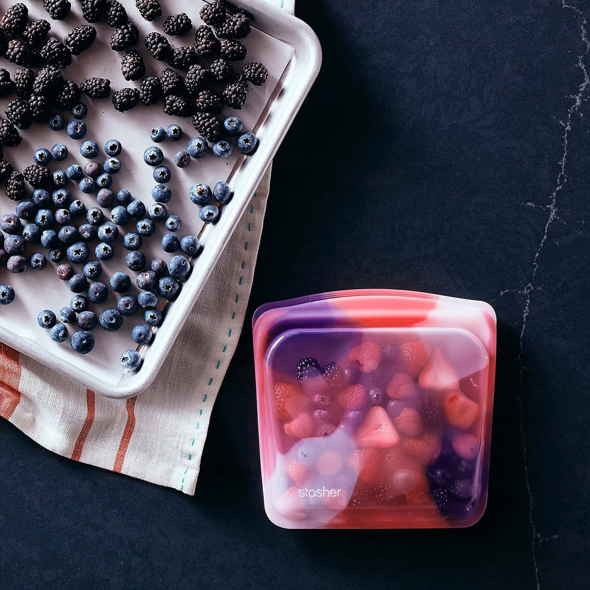 Reusable silicone food storage bag with berries and fruit, rectangular tie-dye pink lid