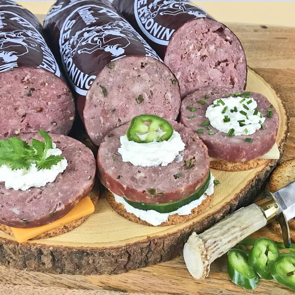 Summer sausage seasoning kit with sliced jalapeno sausage rounds and garnish