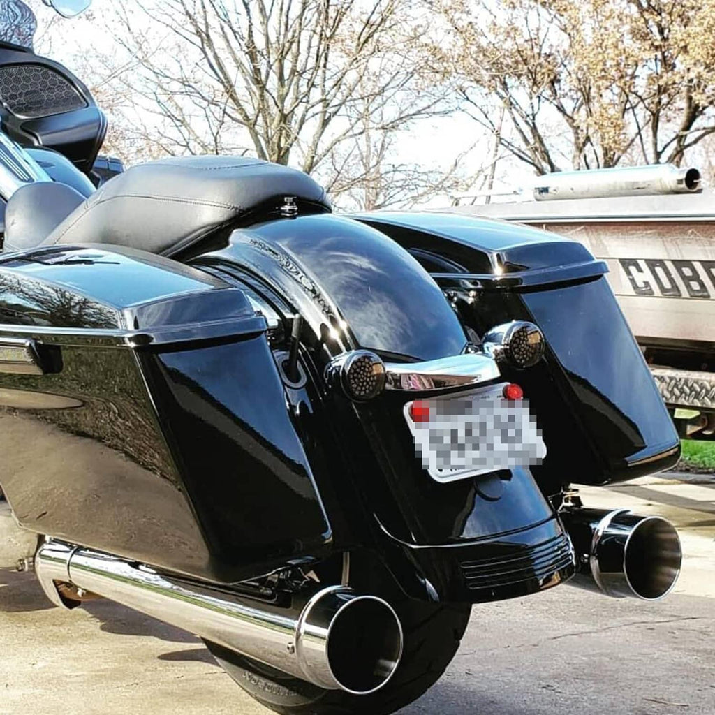 Chrome exhaust slip-on mufflers with round outlet openings and internal dark baffles