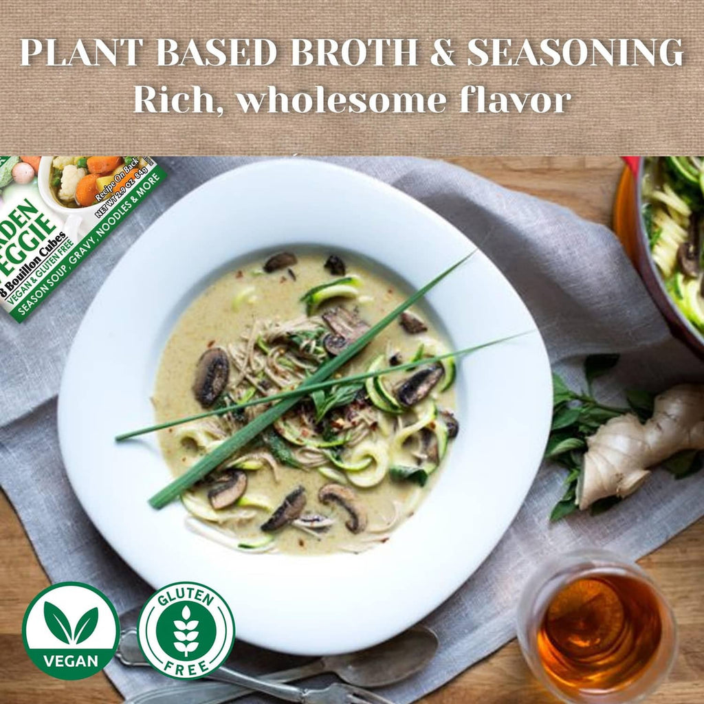 Vegan gluten-free garden veggie soup in white bowl with herb and chive garnish