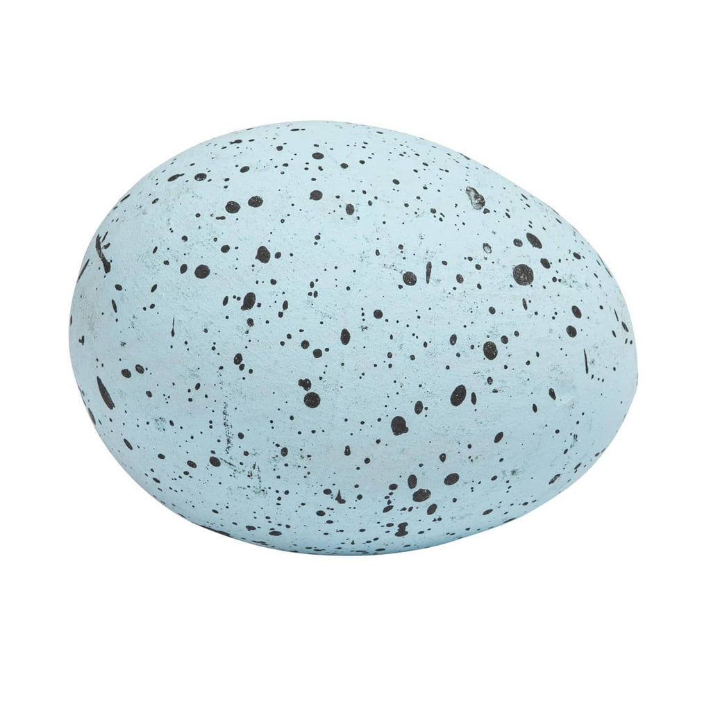 Blue speckled ceramic egg with dark flecked surface