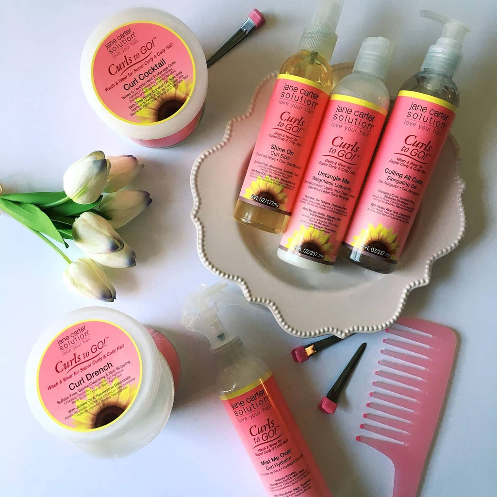 Curl Cocktail cream jar and assorted bottles set with pink-and-yellow labels