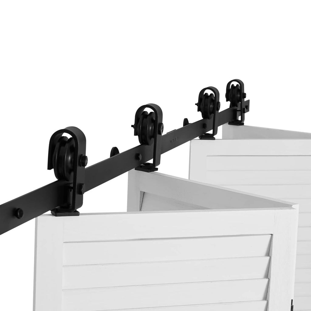 Black barn door track hardware kit with four roller hangers on a metal rail