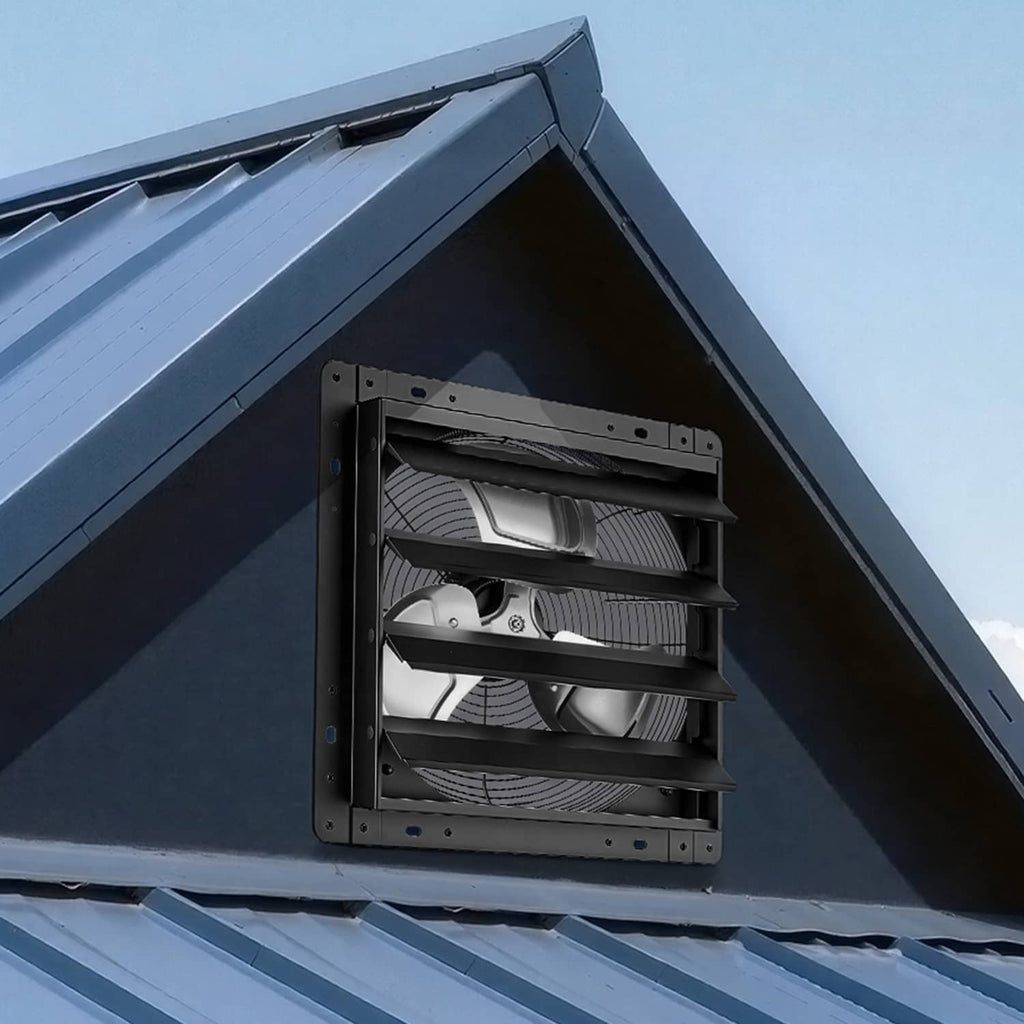 Installed wall exhaust fan with automatic louvers mounted under a roof eave