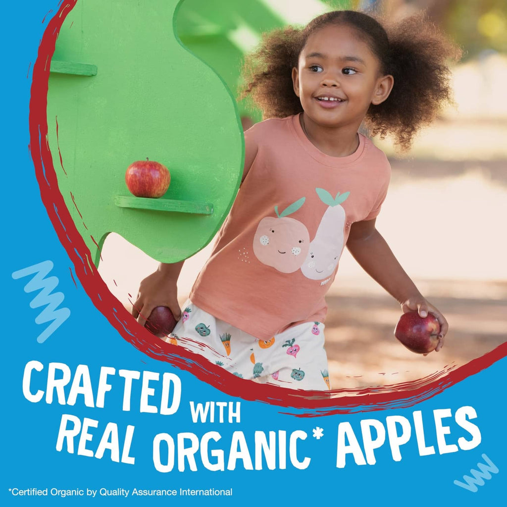 Child holding a snack bar in ad graphic stating crafted with real organic apples