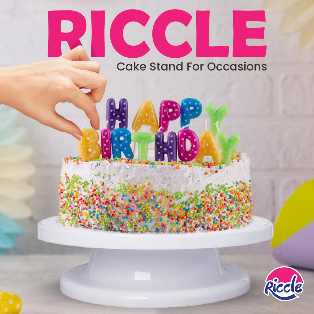 Birthday cake on a white rotating stand with colorful letter candle decorations
