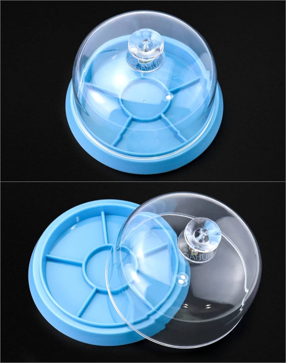 Clear dome dust cover over blue watch tray base with center post