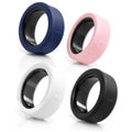 Set of four silicone ring covers in navy, pink, white, and black, for device protection