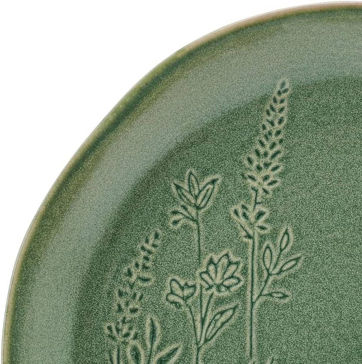 Close-up of green plate with embossed floral-and-leaf botanical design